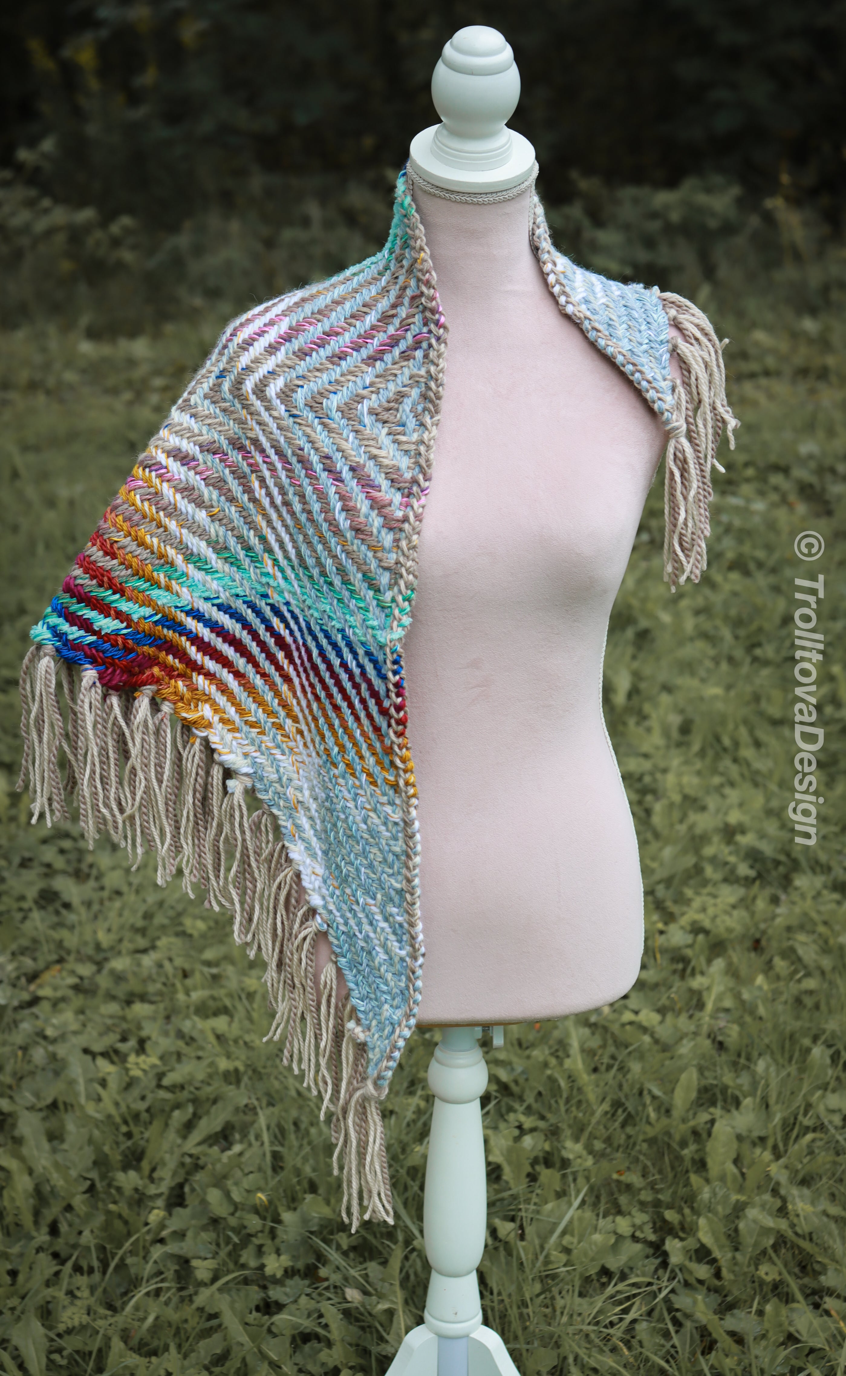 Handwoven triangle shawl made from yarn scraps.
