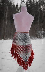 Handwoven triangle shawl made from yarn scraps.