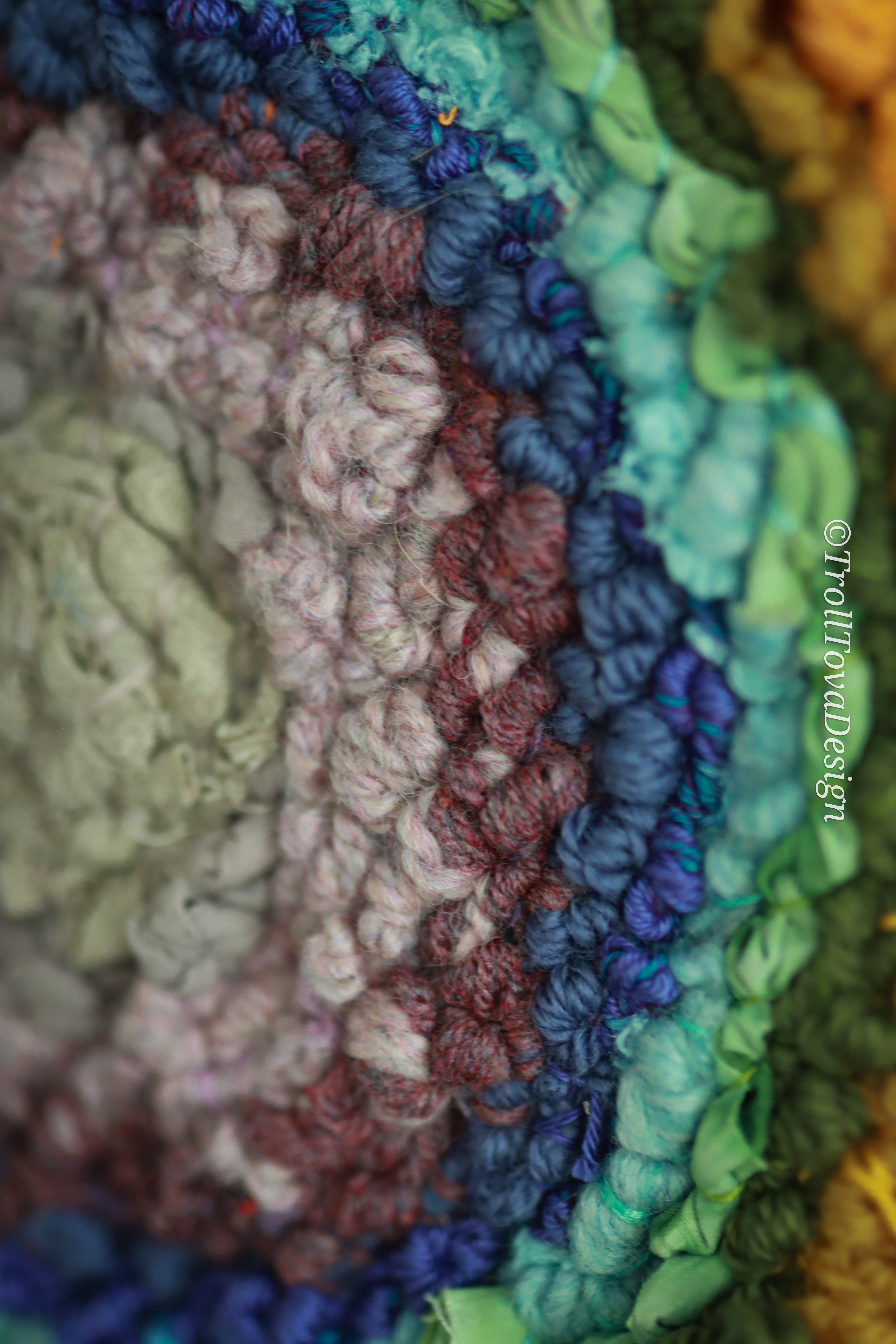 One of a kind handmade textile wall art in gray and rainbow.