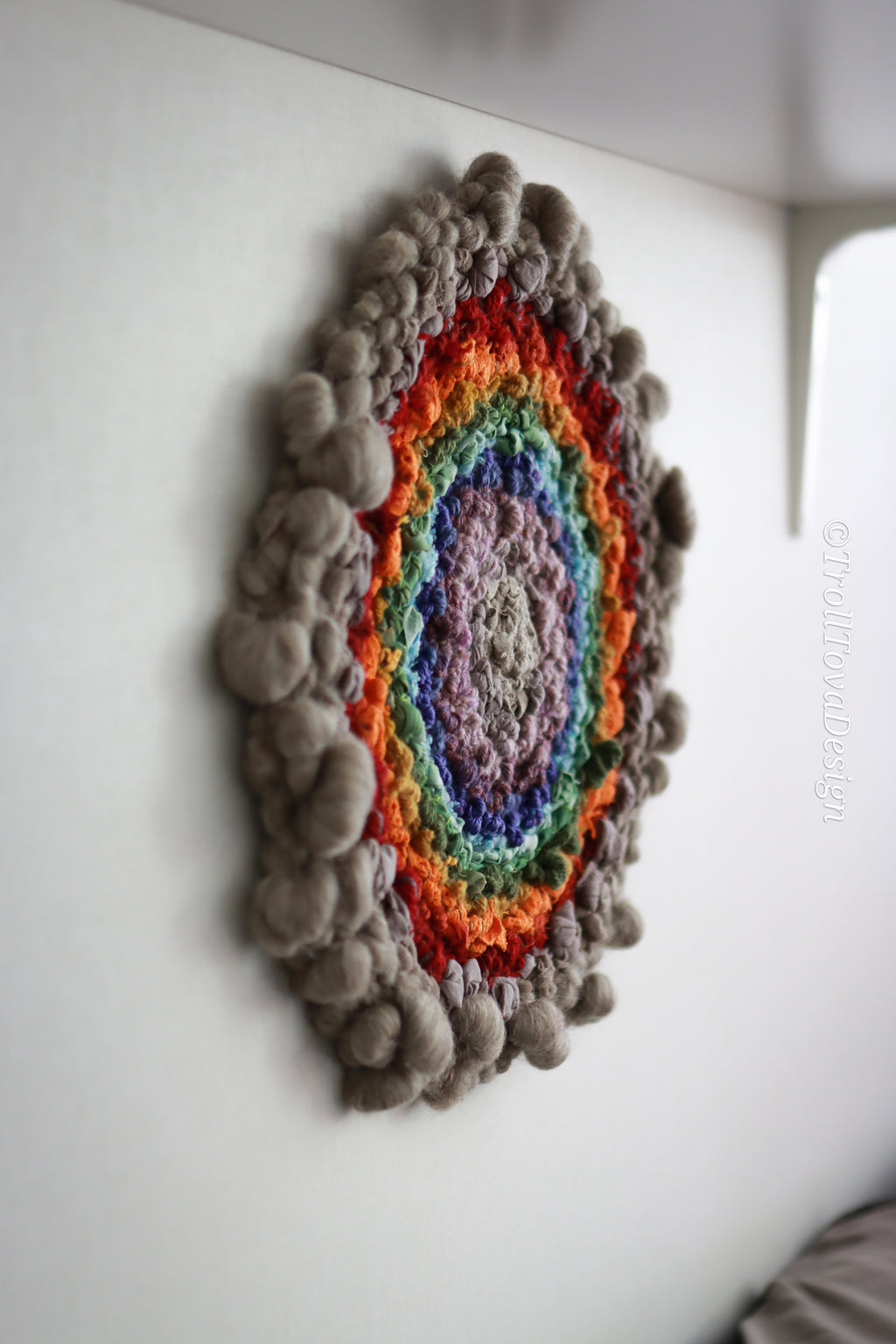 One of a kind handmade textile wall art in gray and rainbow.
