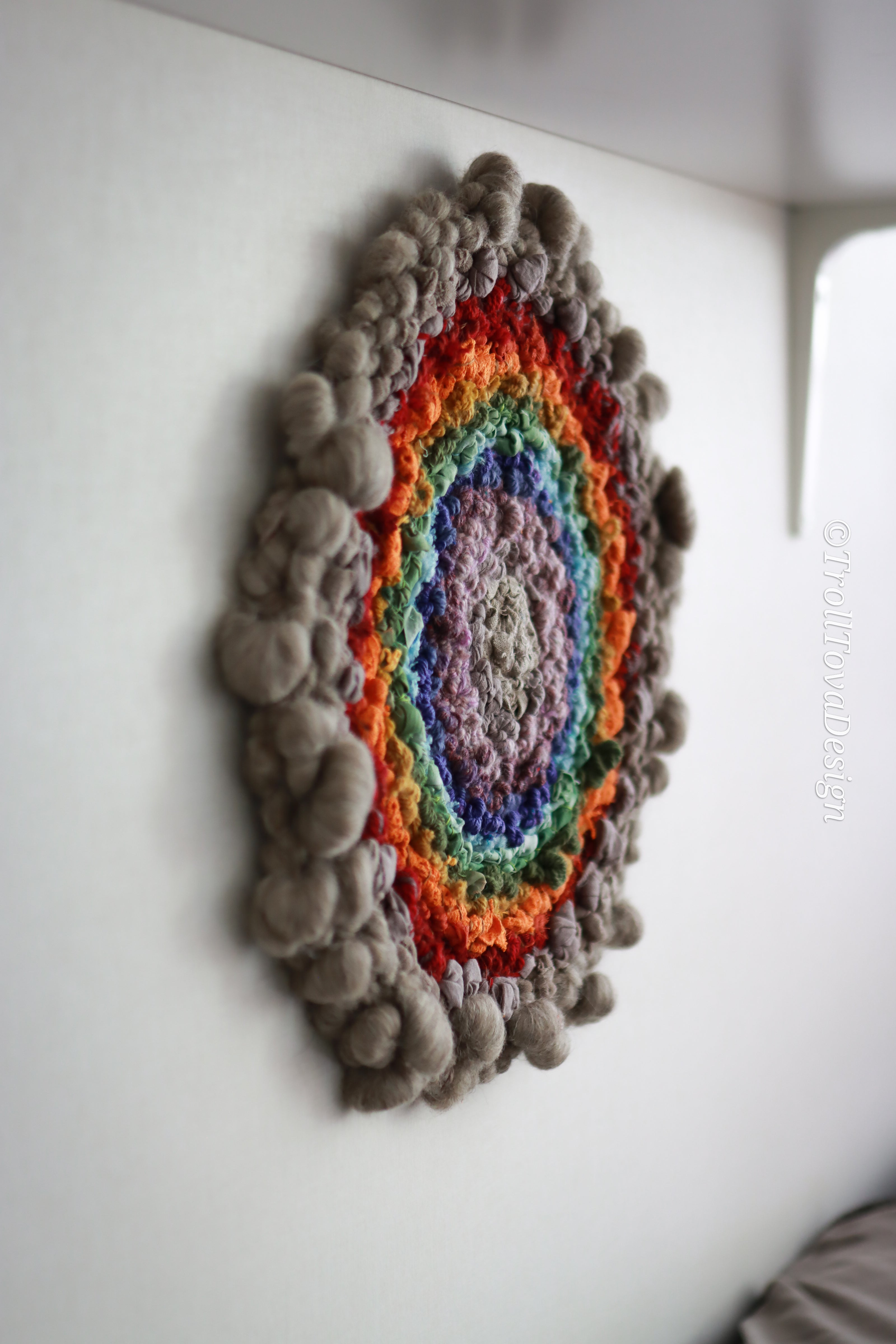 One of a kind handmade textile wall art in gray and rainbow.