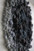 One of a kind handmade textile wall art in gray and black.