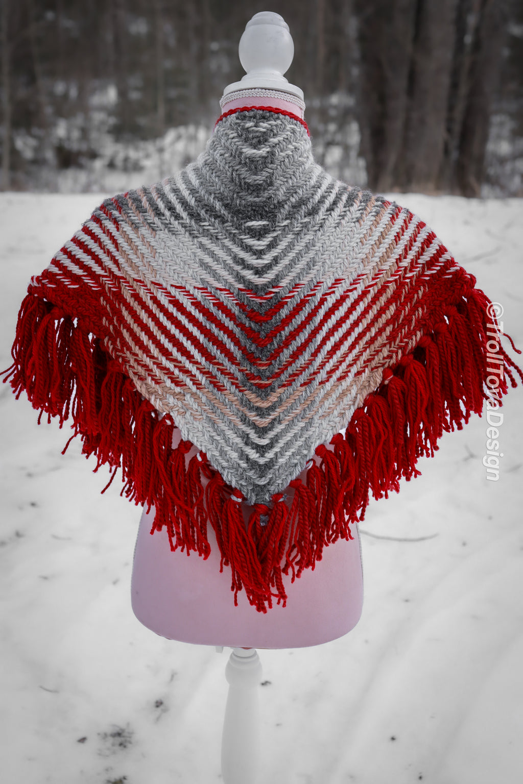 Handwoven triangle shawl made from yarn scraps.