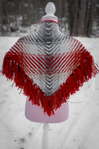 Handwoven triangle shawl made from yarn scraps.