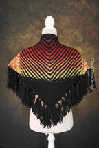Handwoven triangle shawl made from yarn scraps.