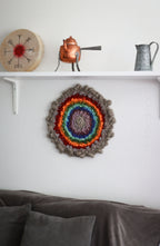 One of a kind handmade textile wall art in gray and rainbow.