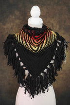 Handwoven triangle shawl made from yarn scraps.