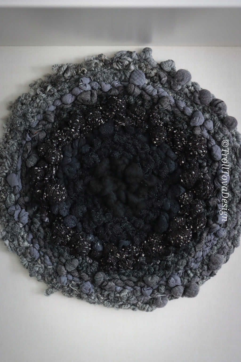 One of a kind handmade textile wall art in gray and black.