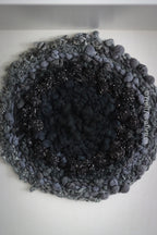 One of a kind handmade textile wall art in gray and black.