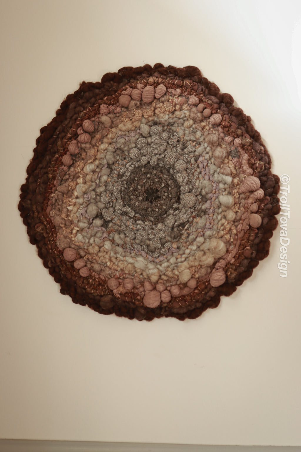 One of a kind handmade textile wall art in gray and brown.