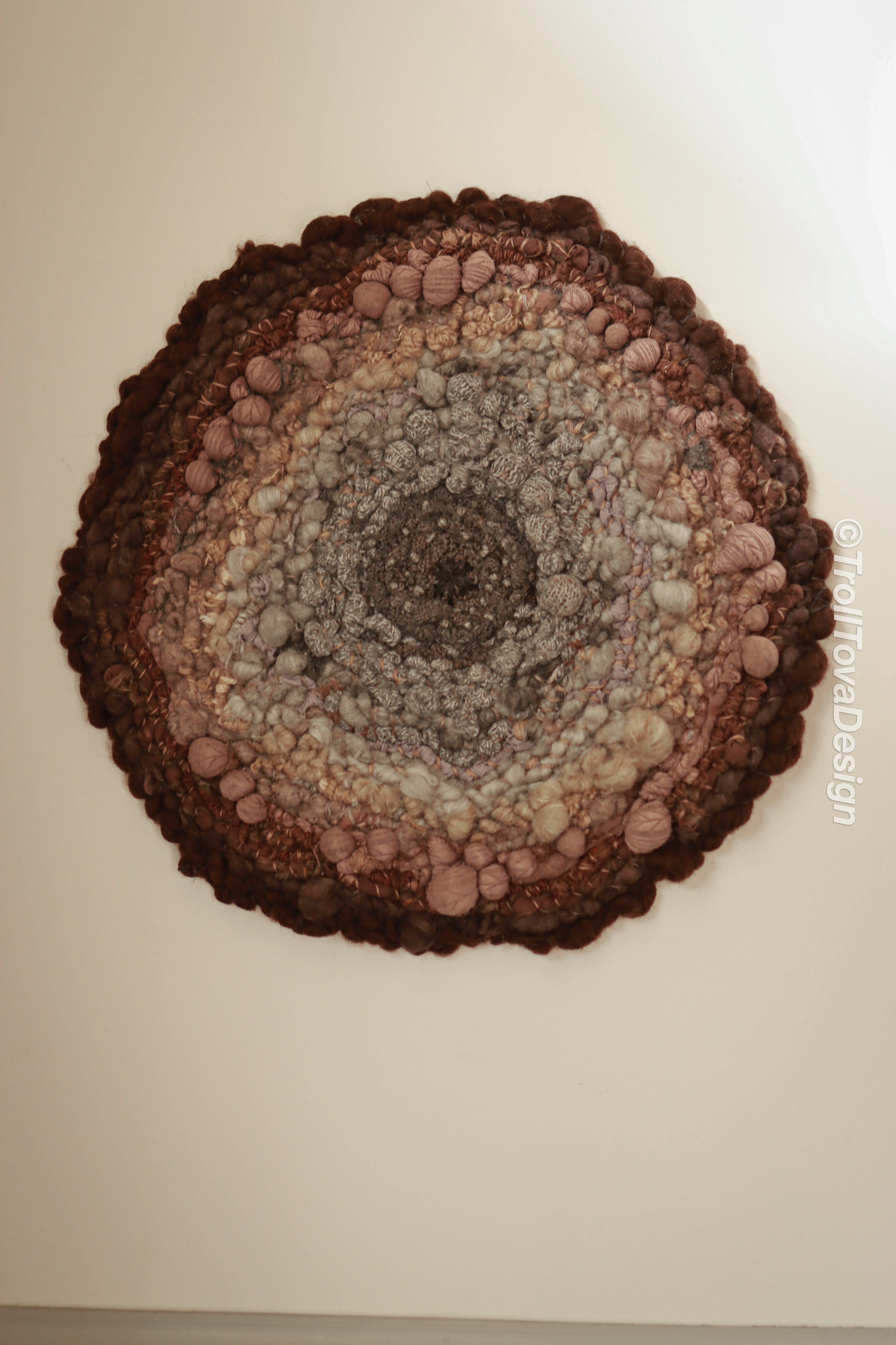 One of a kind handmade textile wall art in gray and brown.