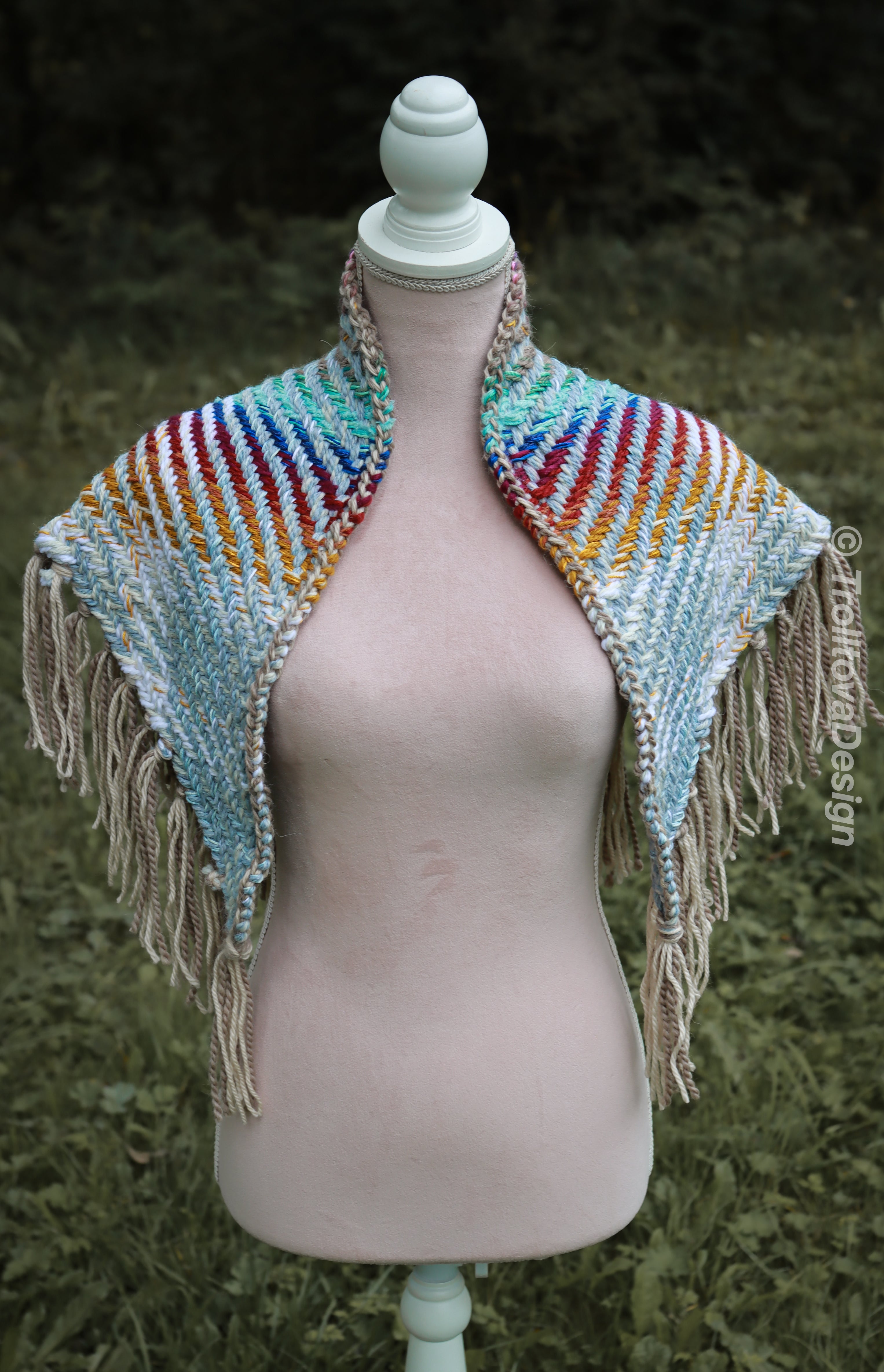 Handwoven triangle shawl made from yarn scraps.