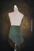 Handwoven triangle shawl made from yarn scraps.
