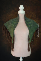 Handwoven triangle shawl made from yarn scraps.