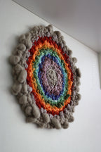 One of a kind handmade textile wall art in gray and rainbow.