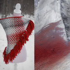 Handwoven triangle shawl made from yarn scraps.
