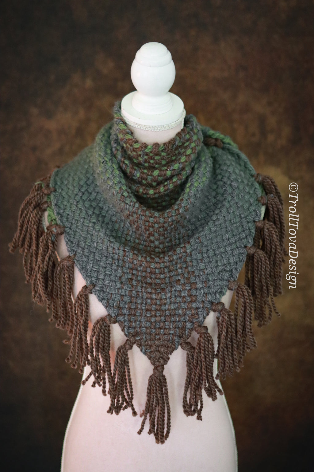Handwoven triangle shawl made from yarn scraps.
