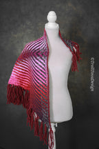 Handwoven triangle shawl made from yarn scraps.