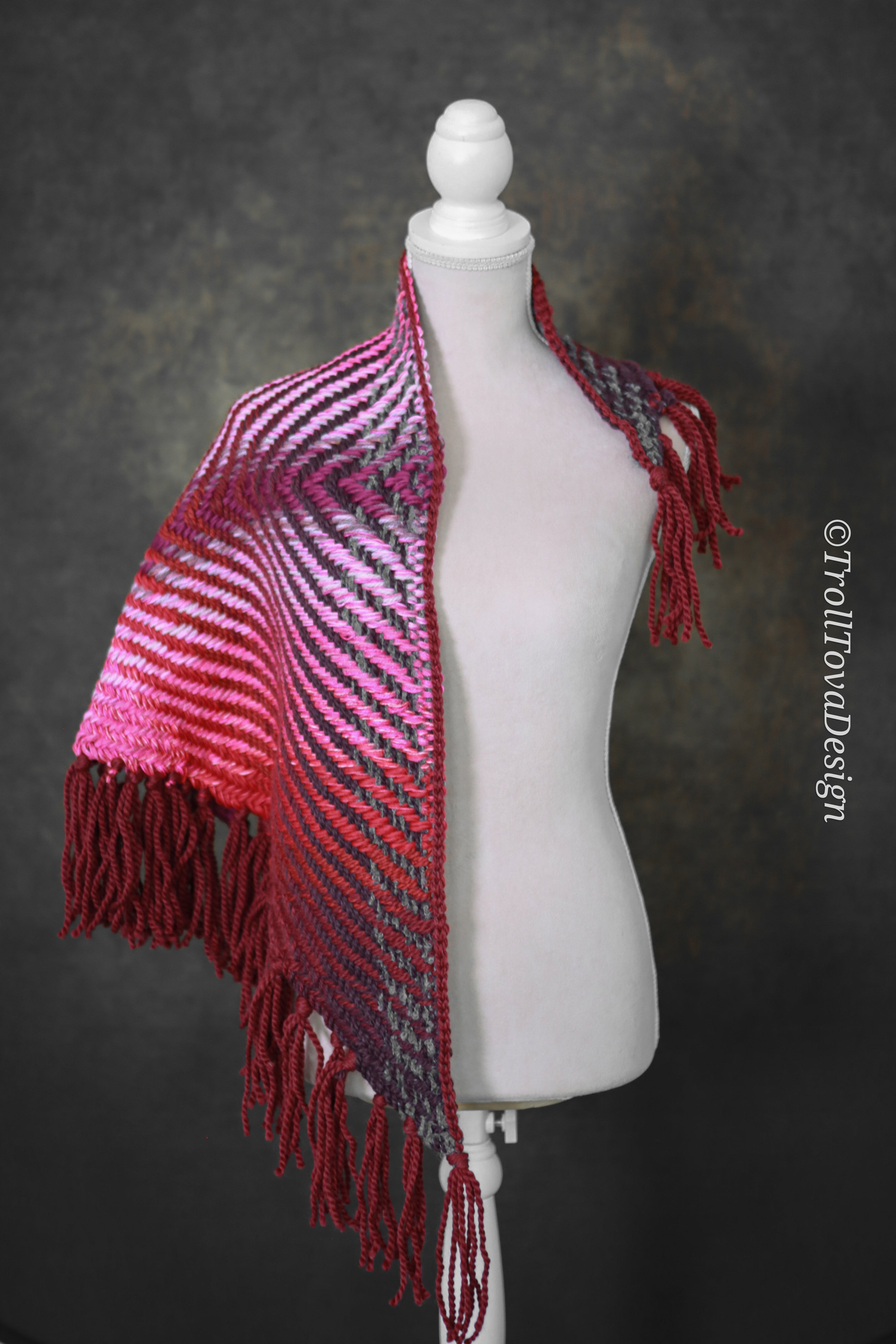 Handwoven triangle shawl made from yarn scraps.