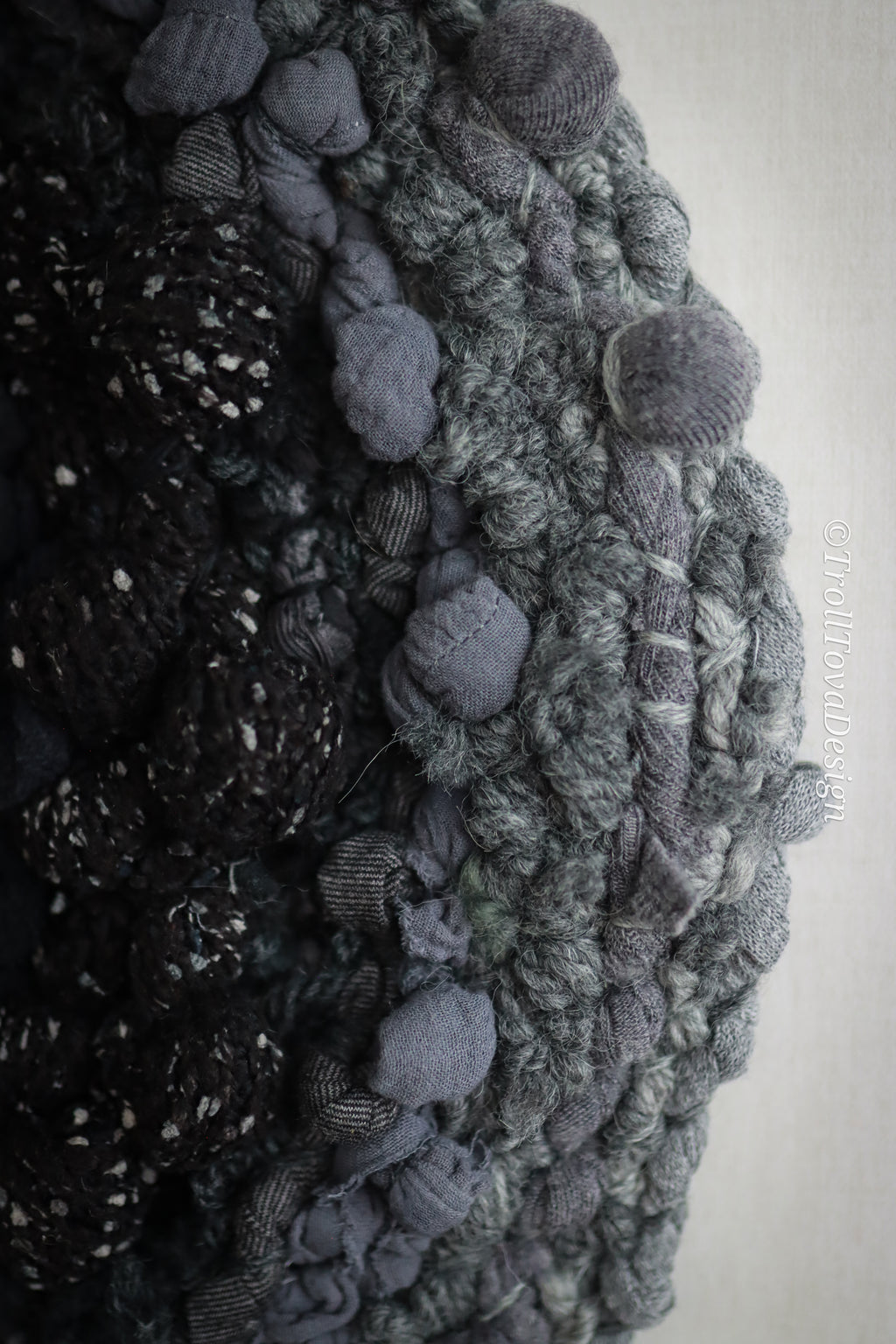 One of a kind handmade textile wall art in gray and black.
