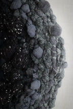 One of a kind handmade textile wall art in gray and black.
