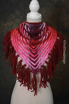 Handwoven triangle shawl made from yarn scraps.