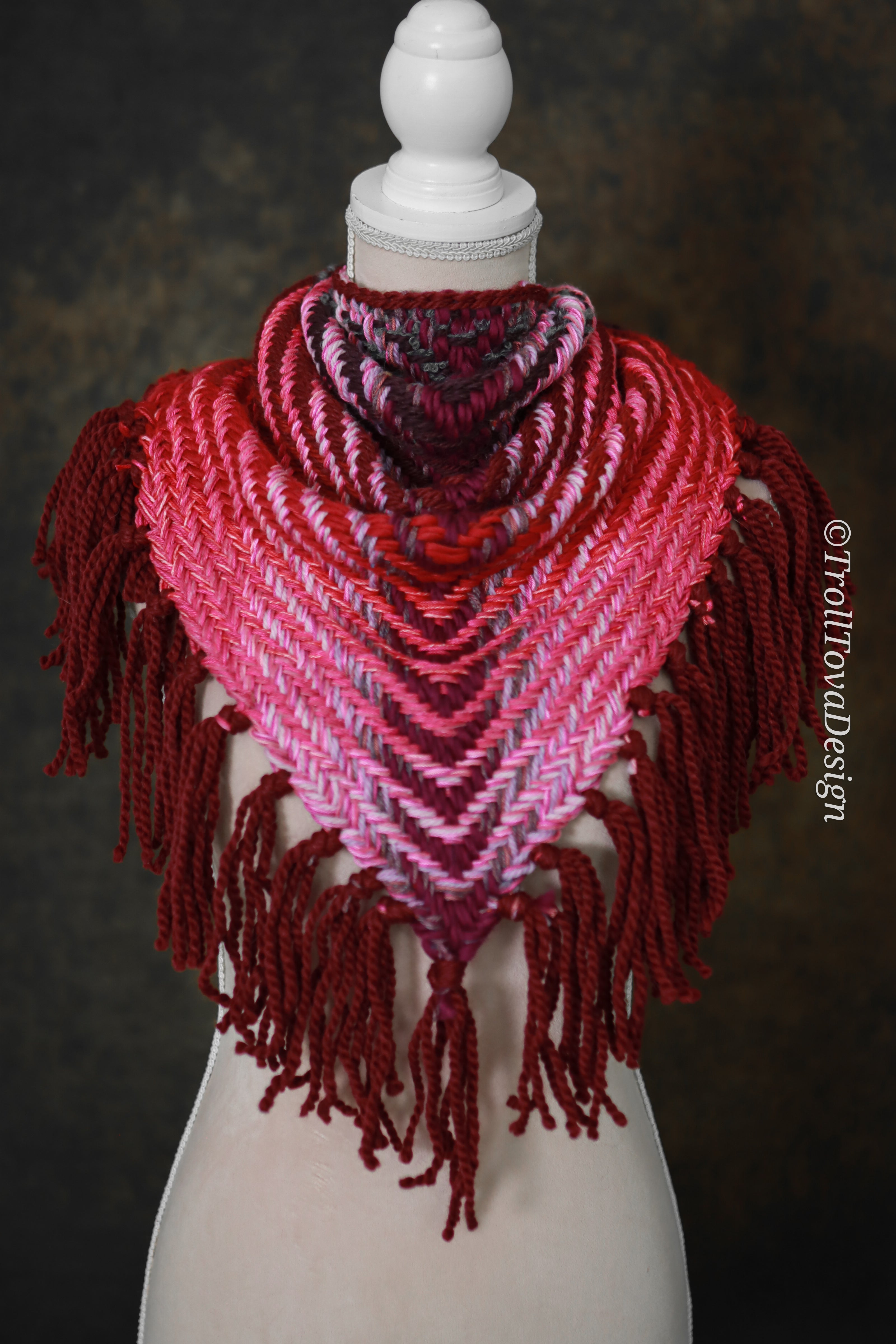Handwoven triangle shawl made from yarn scraps.