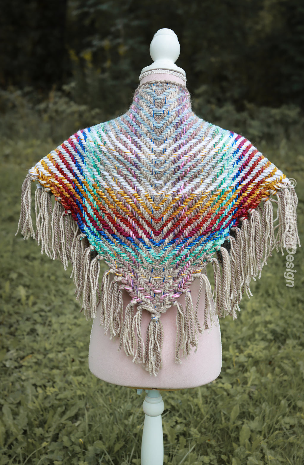 Handwoven triangle shawl made from yarn scraps.