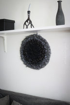 One of a kind handmade textile wall art in gray and black.
