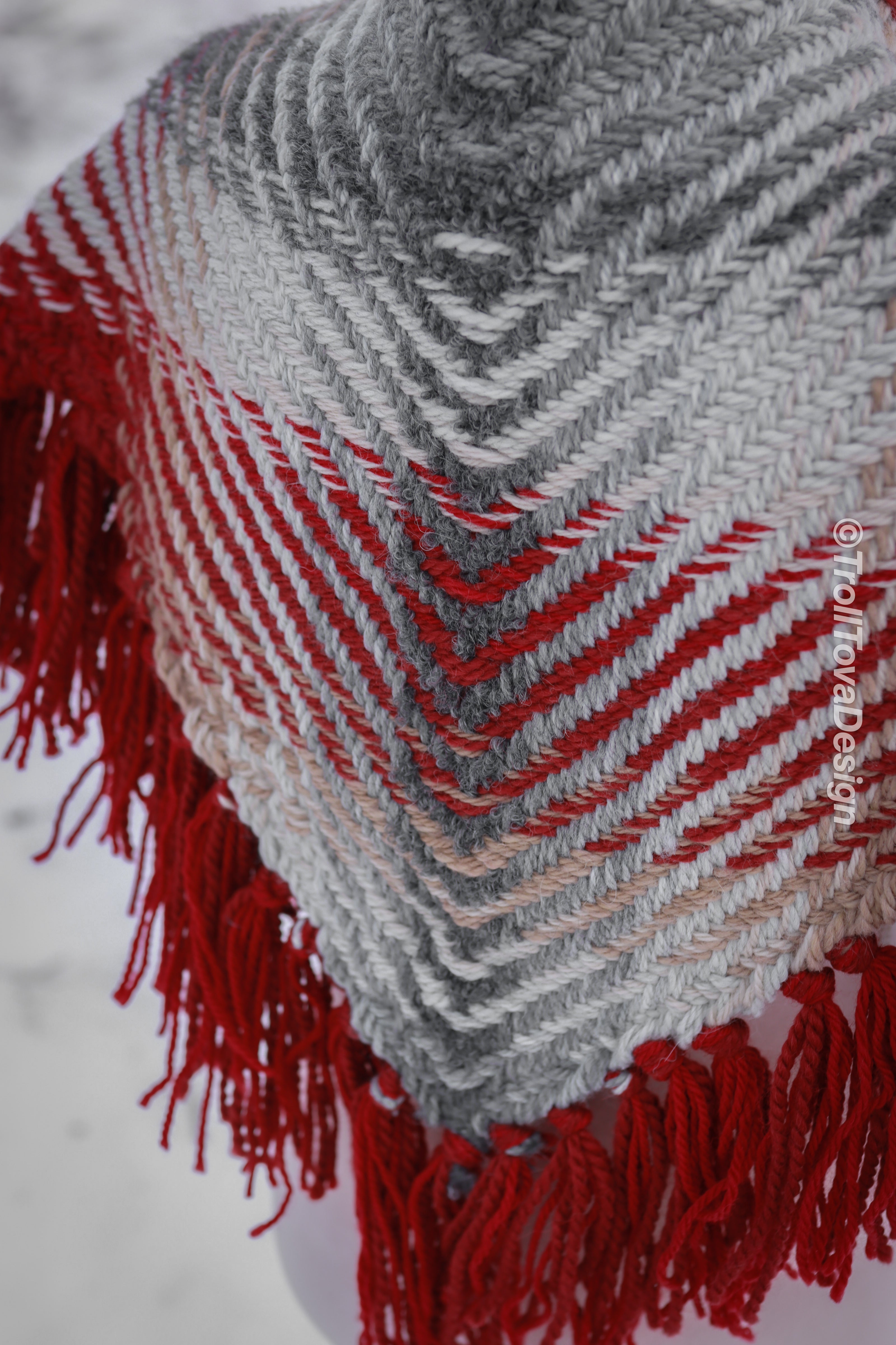 Handwoven triangle shawl made from yarn scraps.