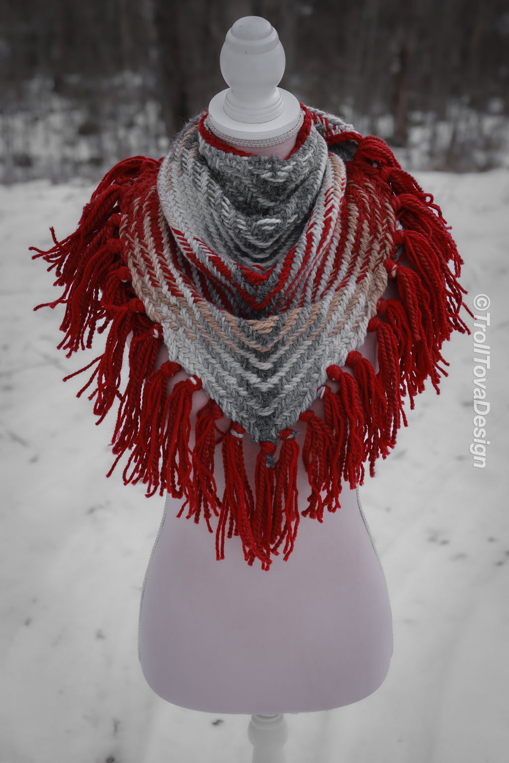 Handwoven triangle shawl made from yarn scraps.