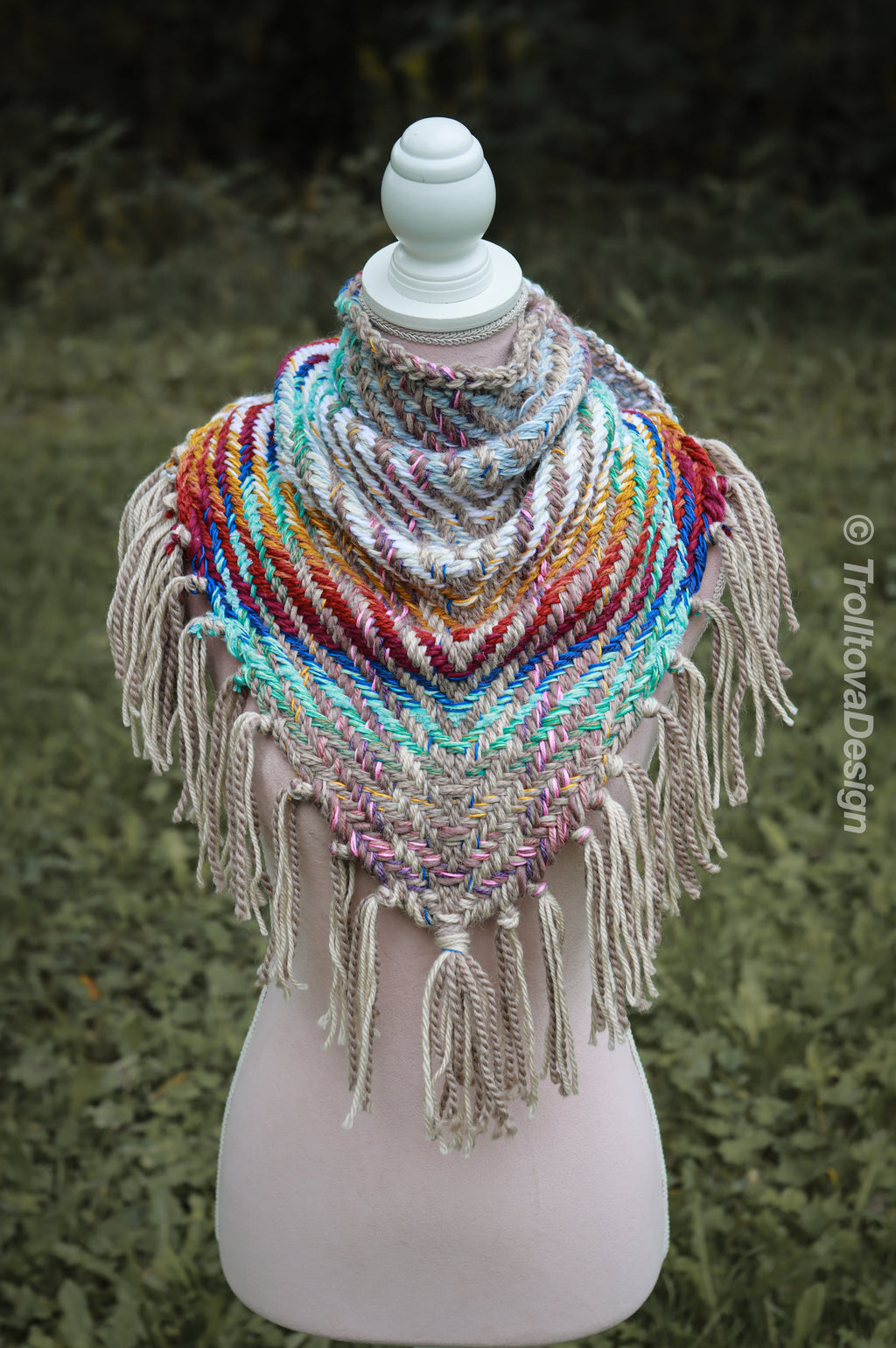 Handwoven triangle shawl made from yarn scraps.